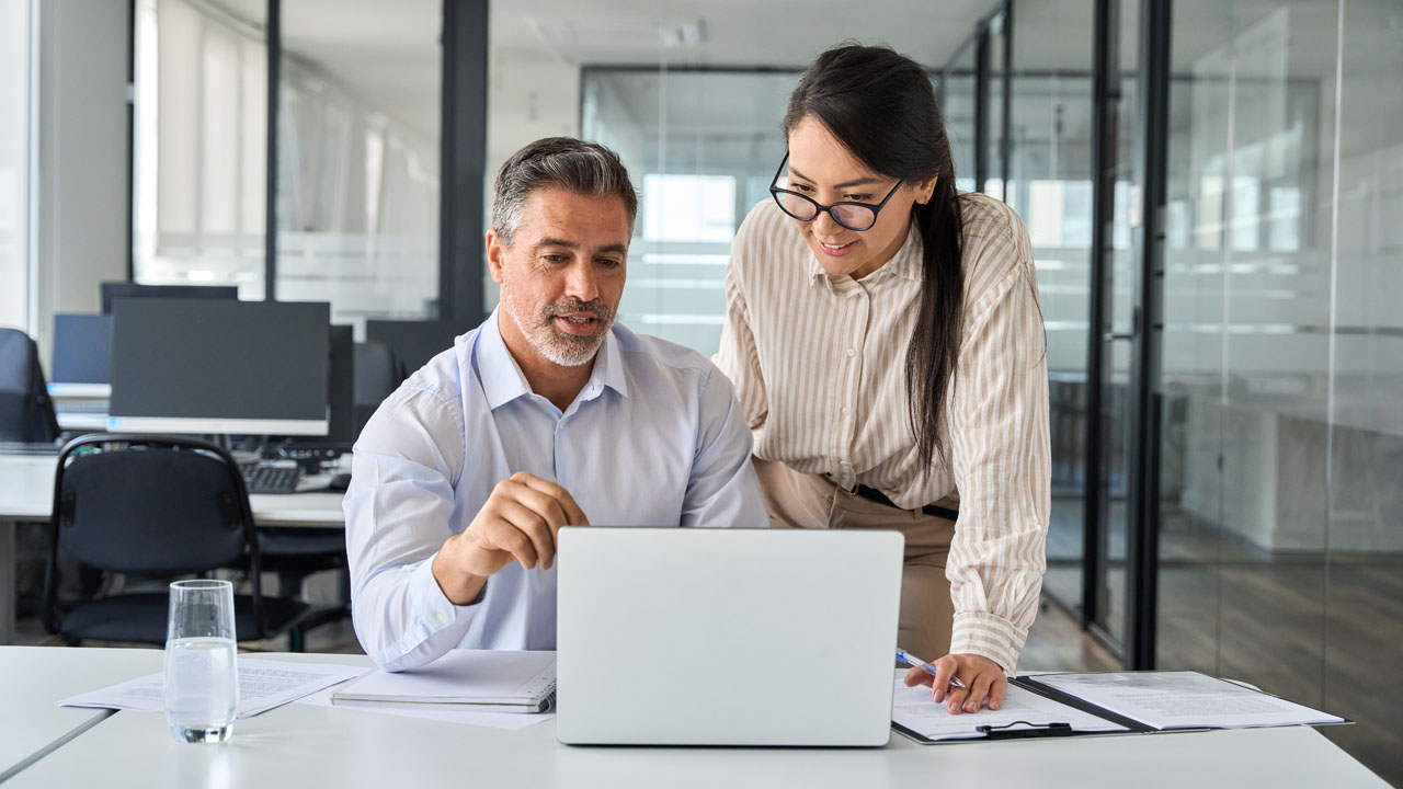 Two coworkers discussing plans