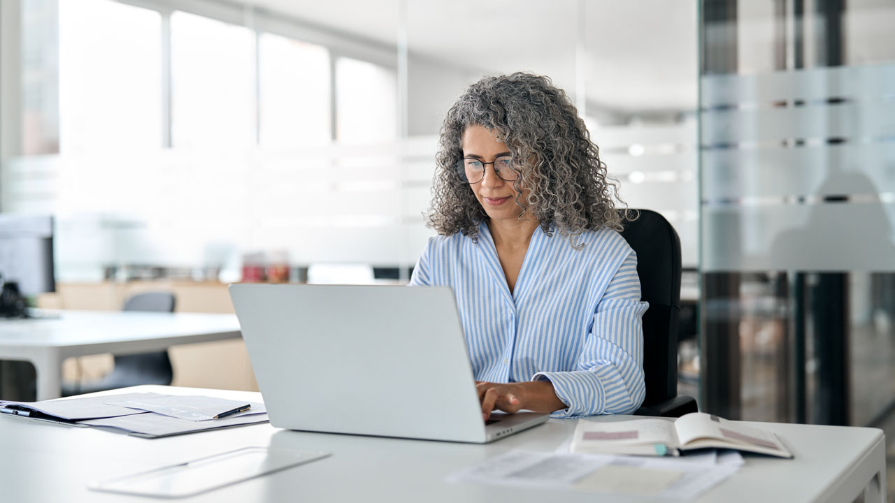 Female typing on a laptop